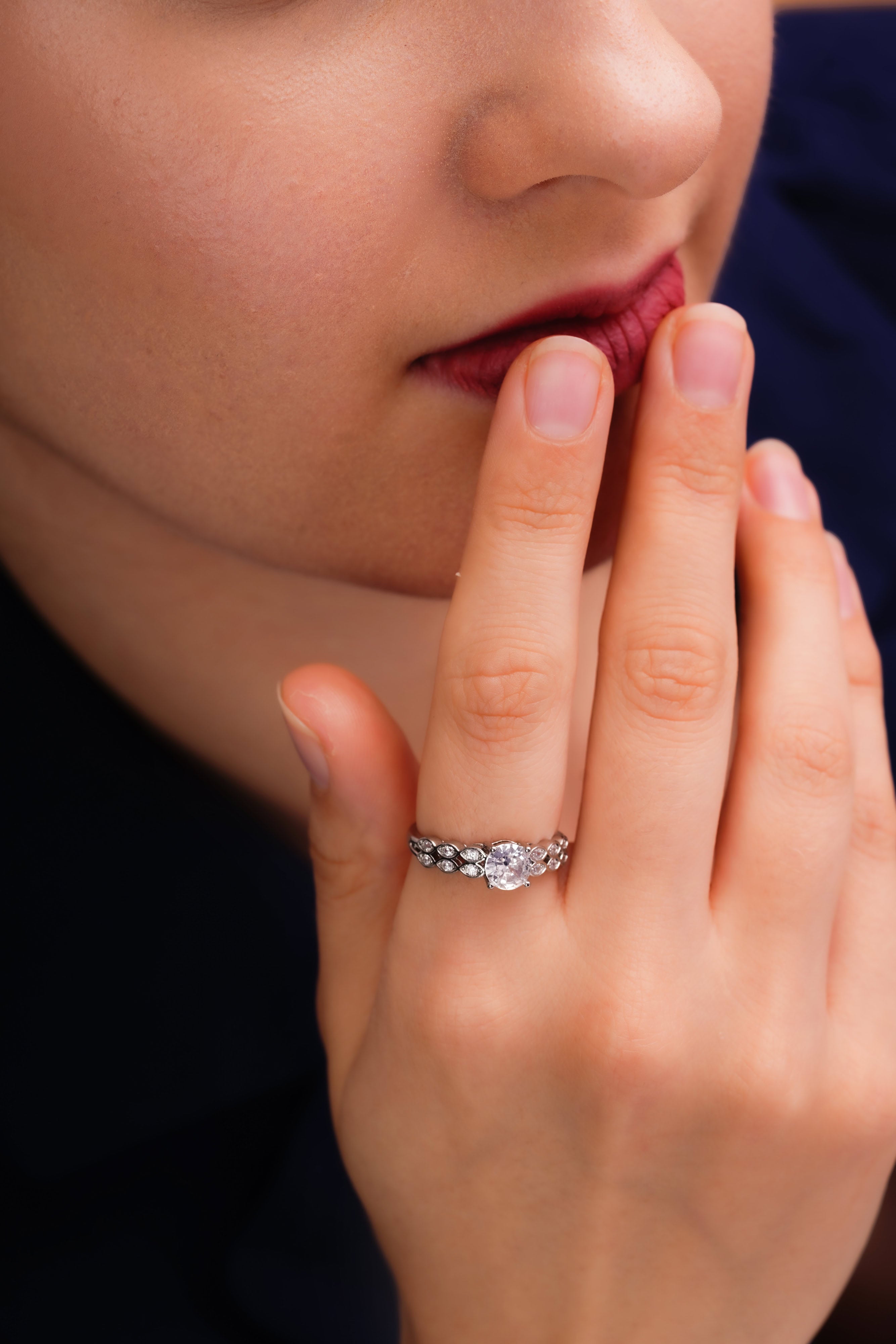 Round Solitaire Ring with Marquise Leaf Band
